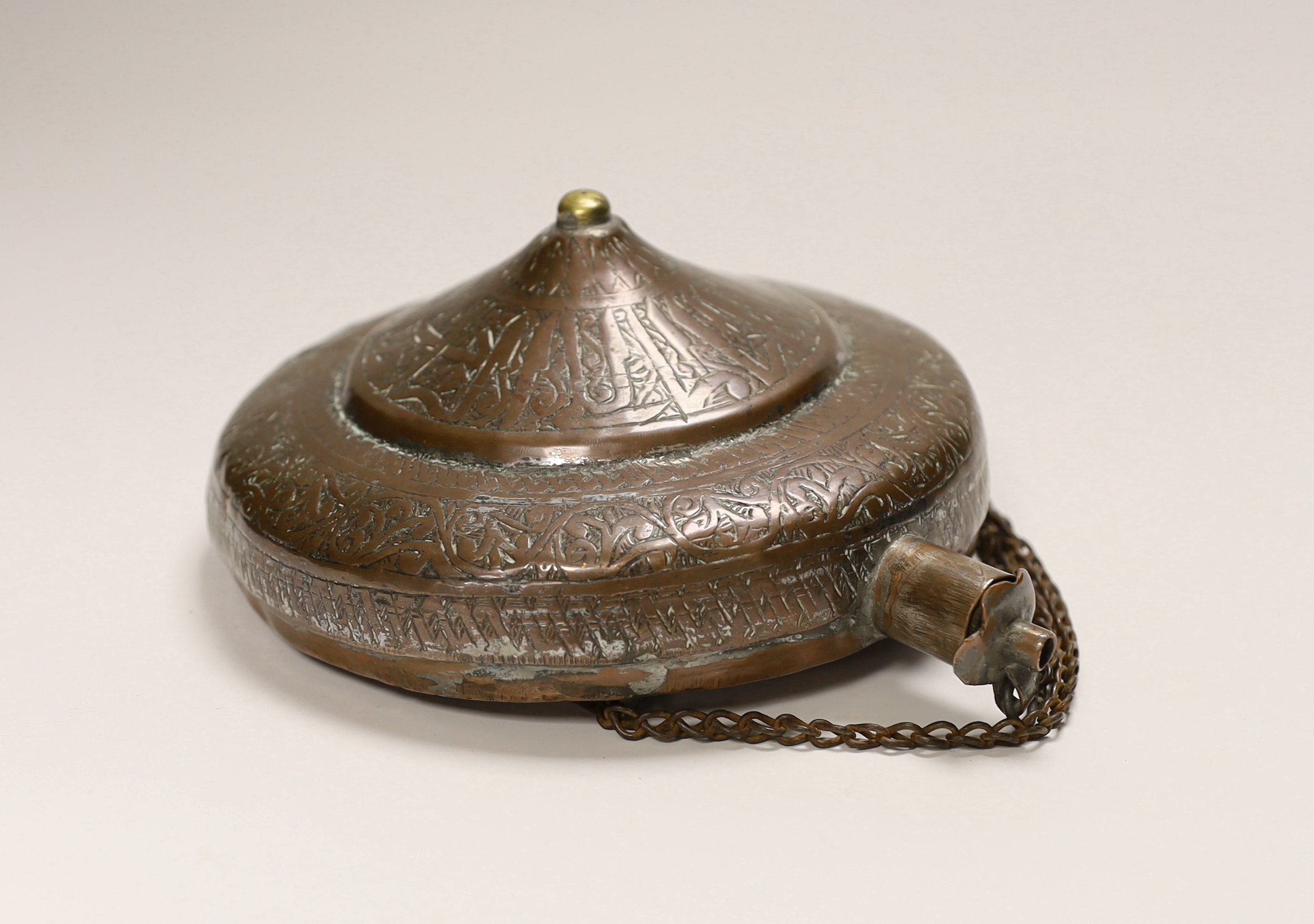 An Ottoman Empire copper water flask with incised decoration, 21cm high